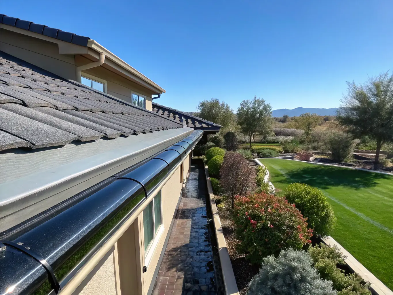 A modern home with newly installed seamless gutters, showcasing their clean lines and effective water management.